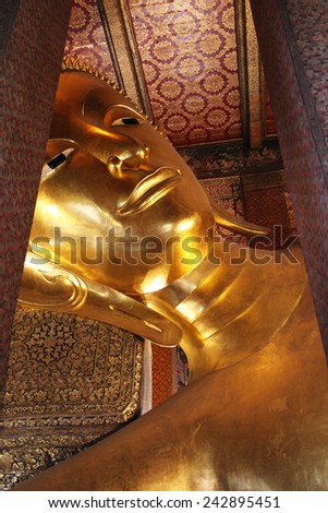 BANGKOK -THAILAND - DECEMBER 30 : Reclining Buddha statue in Temple of Wat Pho, asian style on December 30, 2014 in Bangkok, Thailand