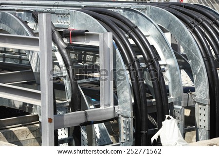 Galvanized steel rack for power cables under installation.