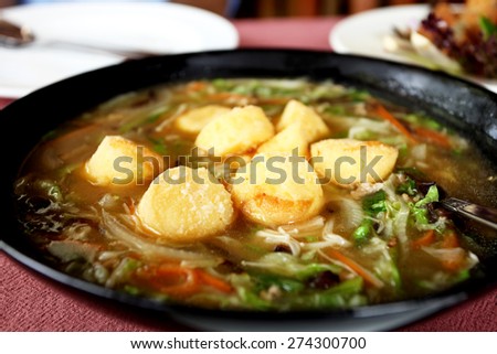 Fry vegetables with bean curd and pork soup, Thai cooking bean curd.