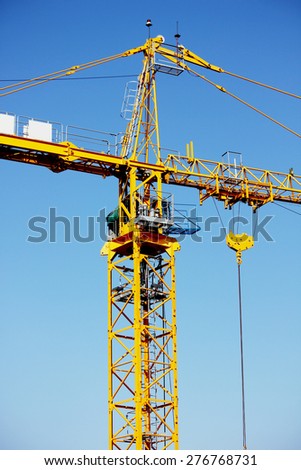 Lifting crane in construction site of concrete bridge.