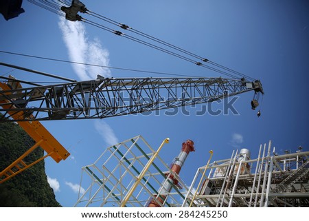 Lifting crane beside Gas combine cycle power plant.