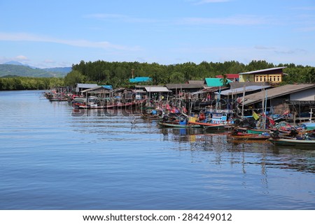 MAY 29, 2015 : KHANORM, THAILAND. Landscape of fishermen village beside the sea canal in southern of Thailand.