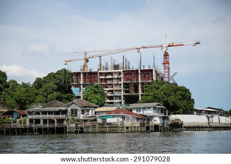 MAY 17, 2015 : BANGKOK -THAILAND. Building and landmark beside the river and transportation in Chaophraya river.