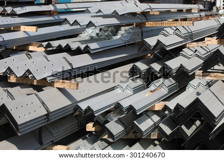 The arrangement of galvanized steel angles bunch in warehouse.
