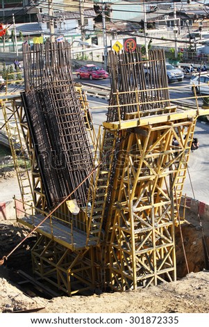 Detail construction foundation and supporting column work and reinforcement of concrete bridge under-construction.