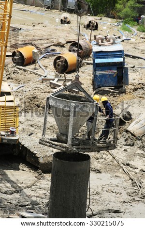 AUGUST 30, 2015 ; NONTHABURI - THAILAND : Concrete boring pile foundation under-construction in wet process with heavy equipment at Eletricity generating authority of Thailand, Nonthaburi province.