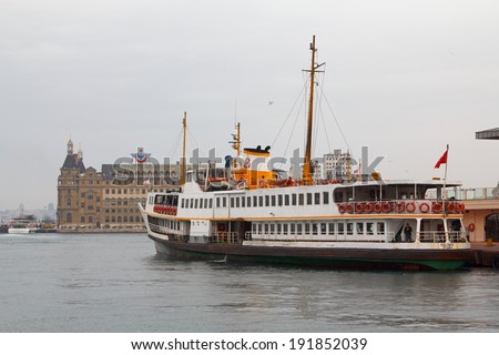 ISTANBUL, TURKEY - APRIL 24, 2014:   Ferry from the pier of asian side of Istanbul  and Haydarpasa Central Train Station
