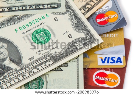 KIROV, RUSSIA - AUGUST 02, 2014: Photo of VISA and Mastercard credit card with USA dollars bills