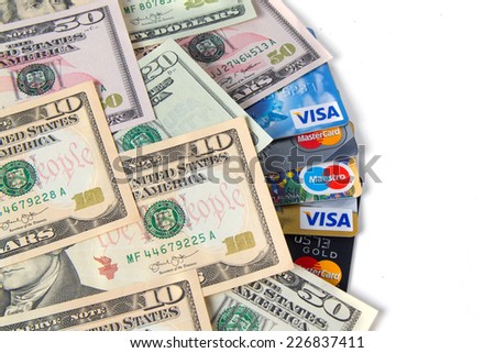 KIROV, RUSSIA - OCTOBER 25, 2014: Photo of VISA and Mastercard credit card with USA dollars bills