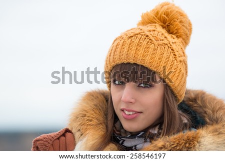 Portrait of beautiful girl in winter hat