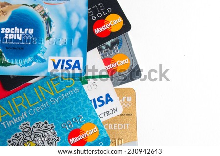 KIROV, RUSSIA - MAY 24, 2015: Photo of VISA and Mastercard credit card with USA dollars bills on white background