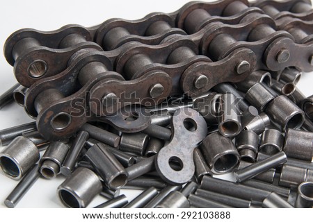 Metal cylinders - elements of the industrial roller chain isolated on white background