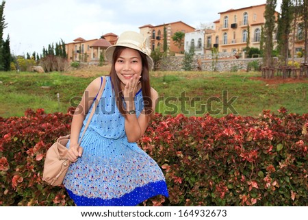 Young happy women or student on the property village background