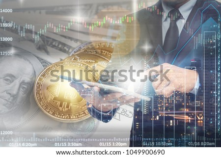 Double exposure of businessman using the tablet with Bitcoin exchange of trading screen on Closeup Bitcoins mockup on the money paper bank of various country, cryptocurrency and investment concept