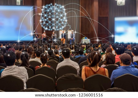Brainstorming concept of Rear view of Audience and Speaker on the stage in the conference hall or seminar meeting, business and education with technology concept