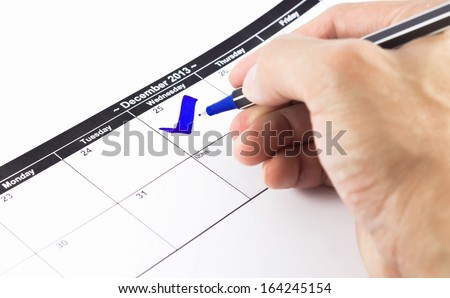 Blue check. Mark on the calendar at 25 December 2013