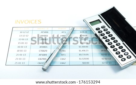 invoice report with calculator and pen for business