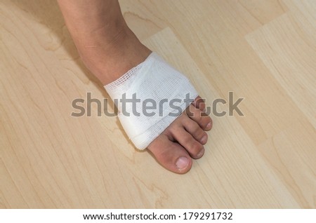 White medicine bandage on injury foot