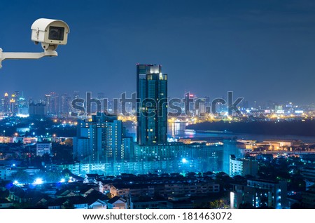 Security camera monitoring the Bangkok cityscape at twilight, blue color white balance, thailand