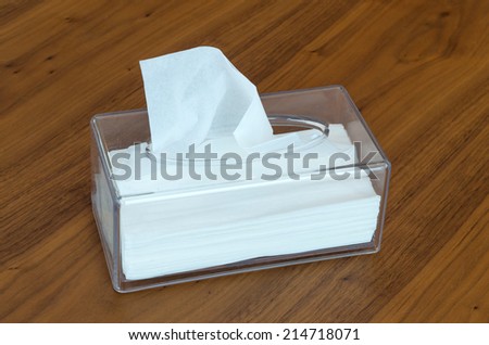 Tissue box on wood background