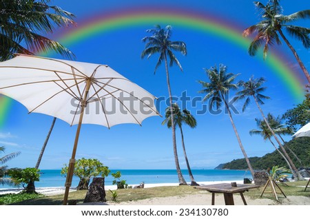 Tropical beach with coconut palm, beautiful umbrella and rainbow, sa-mui island south of thailand