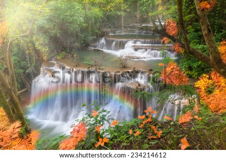Beautiful waterfall with rainbow in the forest