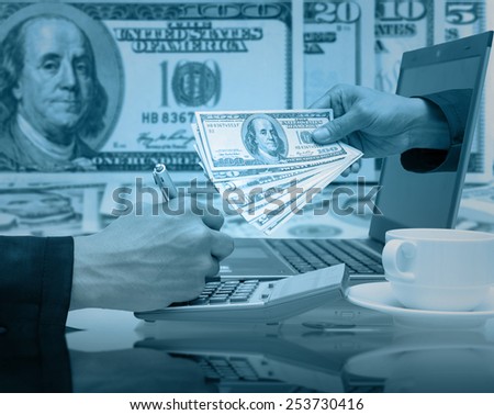 Businessman working with the laptop for earn the dollar money
