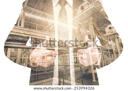 Double exposure of businessman with Industrial equipment Factory