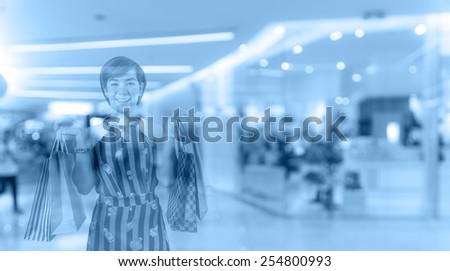 double exposure of shopping happy woman in the department store blur