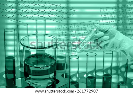 Chemical Laboratory,Scientist holding medical injection syringe with test tube