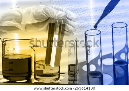 Chemical Laboratory,scientist dropping the reagent into test flask and tube