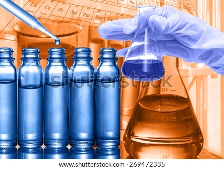 Chemical Laboratory,scientist dropping the reagent to test tube