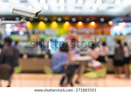 CCTV security camera on monitor the food court store blur background with bokeh