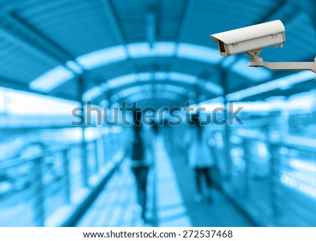 CCTV security camera on monitor the Abstract blurred photo of people with pathway skywalker