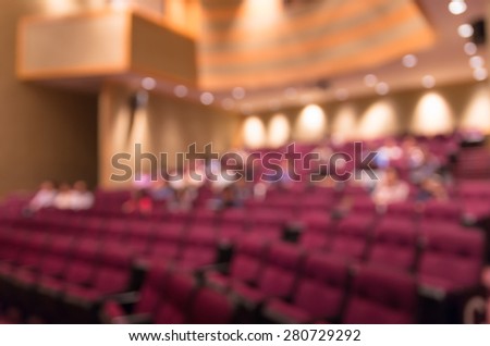 Abstract blurred photo of conference hall or meeting room with attendee background
