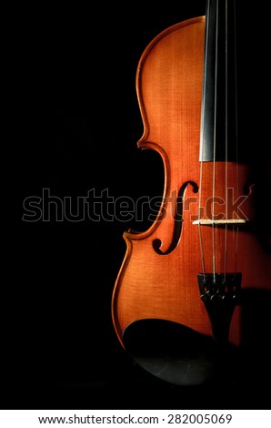 Closeup Violin orchestra musical instruments on black background