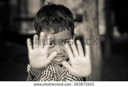 SIEM REAP, CAMBODIA - MAY 2 : Unidentified boy of Cambodian poses for a portrait at kabal spean on May 2, 2015 in Siem Reap, Cambodia