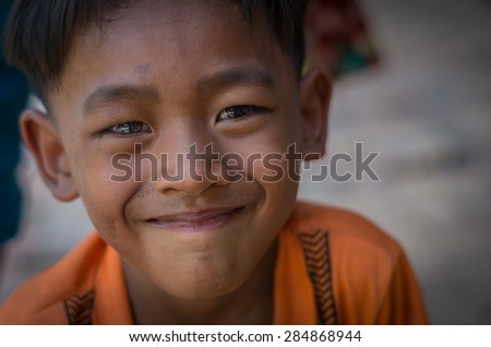 SIEM REAP, CAMBODIA - MAY 2 : Closeup face og Unidentified boy of Cambodian at kabal spean on May 2, 2015 in Siem Reap, Cambodia