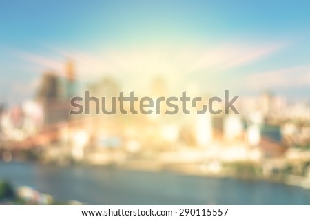 abstract Blurred photo of cityscape with sun background, blur backgrounds concept.