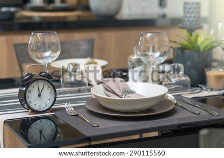 restaurant set with vintage clock at lunch time at Luxury Interior kitchen room background