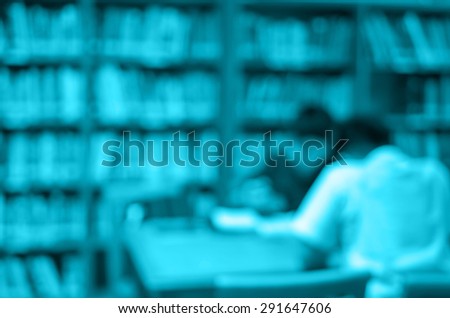 abstract Blurred photo of student reading in library, blur backgrounds concept.