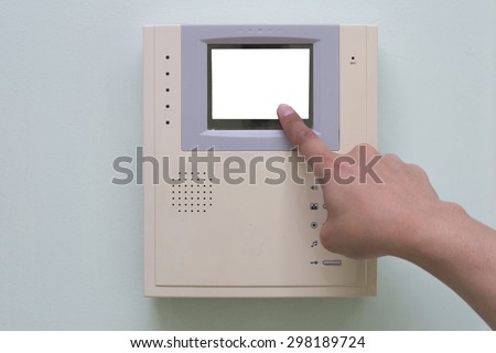 Human finger pushing button of video intercom equipment