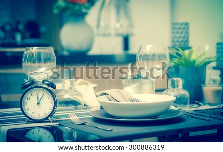restaurant set with vintage clock at lunch time at Luxury Interior kitchen room background