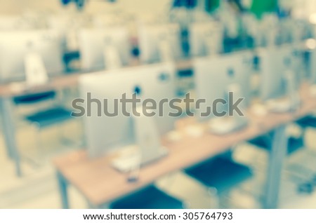 Abstract blurred photo of empty server room, education and business concept