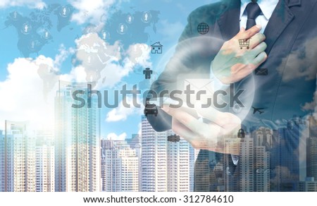 Double exposure of businessman using the tablet for Information technology on world map and cityscape background, business concept,Elements of this image furnished by NASA