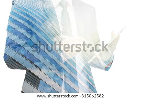 Double exposure of businessman with cityscape building glass