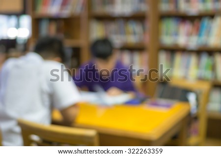 abstract Blurred photo of student reading in library, blur backgrounds concept.