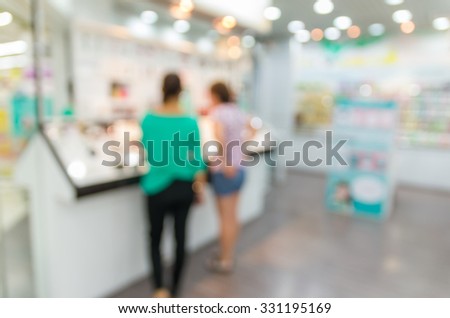 Abstract blurred photo of cosmatic store in department store bokeh background