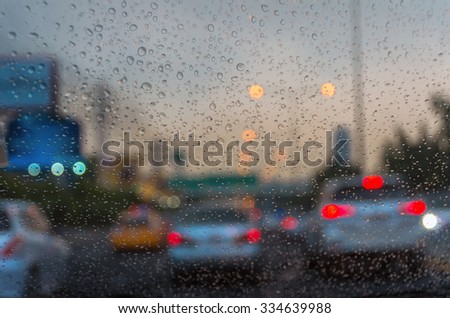 Rain drop On the car Glass Background. photo blurred of car on the Street