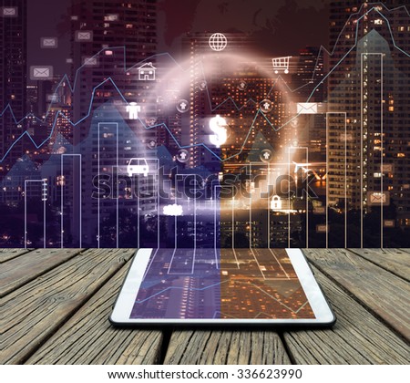 Conceptual image of tablet on cityscape and financial graph with business logo background